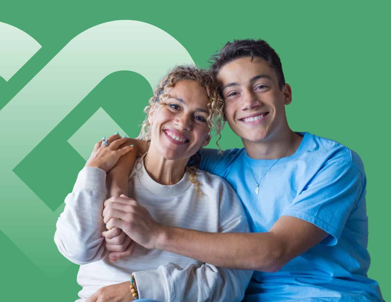 Image of a teenager with arm around his mom who started their journey to mental health